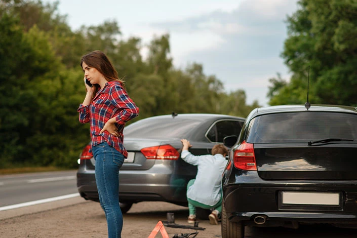 A woman calls her lawyer after an accident in Wyoming.