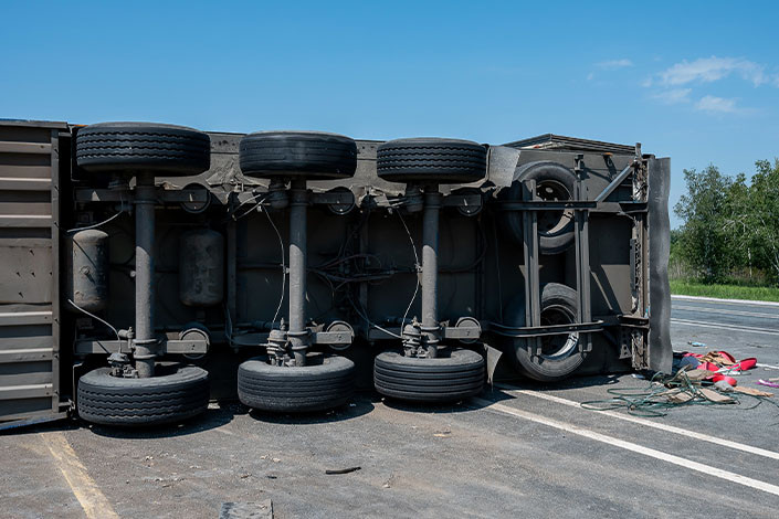A semitruck is overturned on a Wyoming highway in a crash requiring the help of a commercial truck accident lawyer.