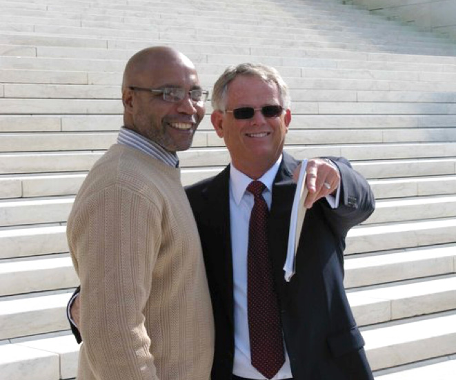 Doug McCalla on the steps of the Supreme Court of the United States with client Terry Harrington